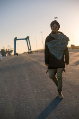 Young Asian Bearded Tourist man with Dreadlocks and scarf on head Having Fun in Essaouira, Morocco...