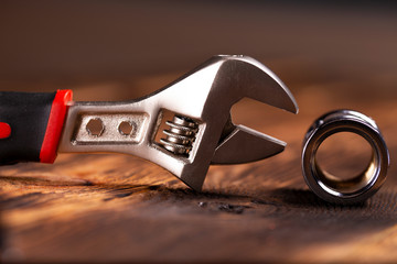 closeup of adjustable wrench and coupling. fitting 1/2.Nice blurring background.