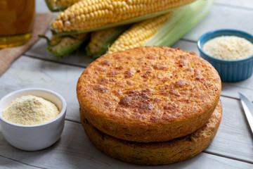 Fresh baked corn bread on wooden background