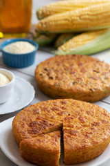 Fresh baked corn bread on wooden background