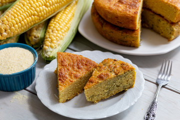 Fresh baked corn bread on wooden background