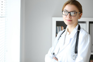 Doctor woman at work. Portrait of female physician at hospital office. Medicine and healthcare concept