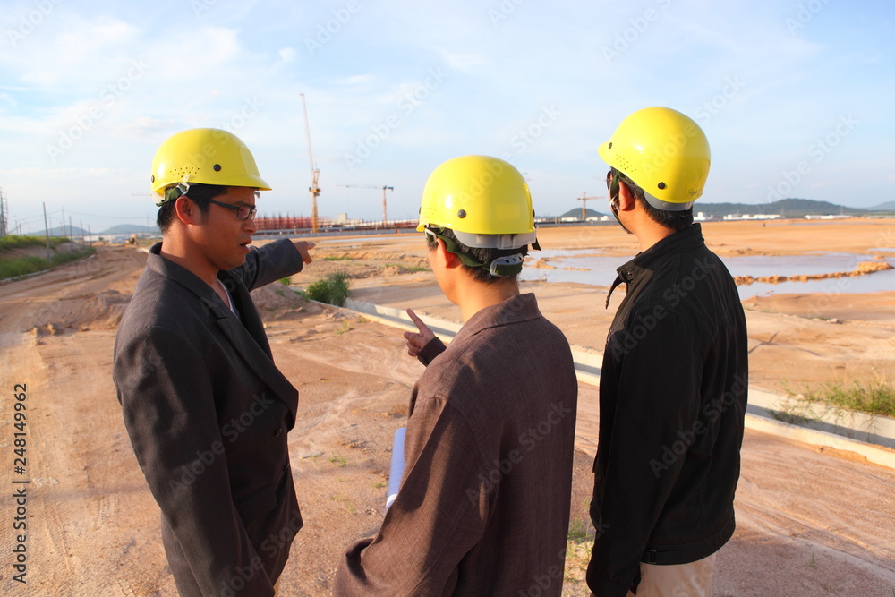 Wall mural engineer on site ,they are working at building construction area.