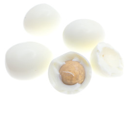 Peeled boiled eggs on a white background