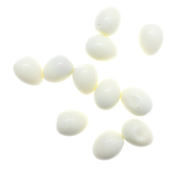 Peeled boiled eggs on a white background
