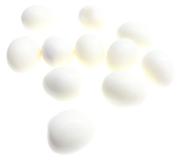 Peeled boiled eggs on a white background