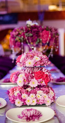 Wedding party table flowers on the table. Pink pions and wite chrysanthemums