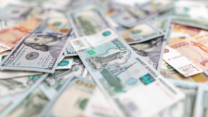 Dollars and Russian rubles on the table as background