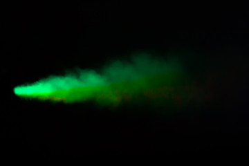 Green colorful smoke on a black background