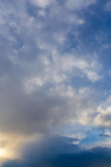 Clouds after rain before sunset as a background