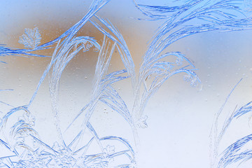 Snow patterns on glass as an abstract background