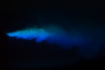 Blue colorful smoke on a black background