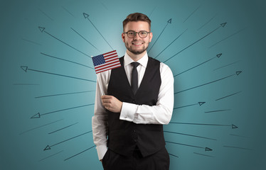 Smiling young man standing with flag and multidirectional arrows around
