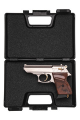 Pistol in a special plastic case for transportation and storage isolated on white