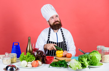 Reason in food. Bearded man cook in kitchen, culinary. Vegetarian. Mature chef with beard. Healthy...