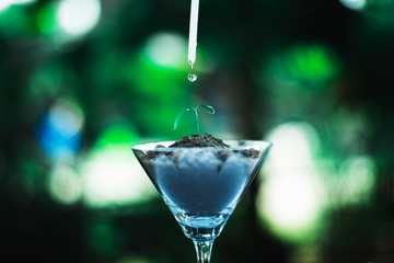 sprout growing in glass with water drop, nature and care concept