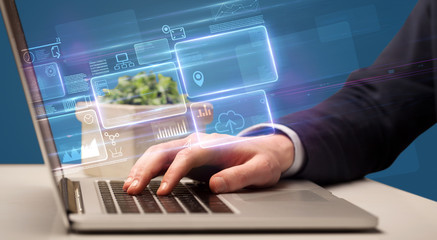 Hand typing on laptop with online accounting system concept
