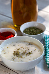 Traditional yayla soup (yoghurt soup) on wooden background