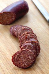 Turkish Sausage Sucuk on the wooden table