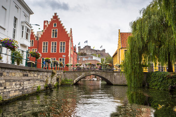 Naklejka premium Historic buildings next to the river in the Ghent city center, Belgium