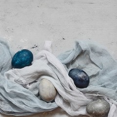 Dyed Easter vintage eggs with scuffs on a light gray background. Stylish Background with easter...