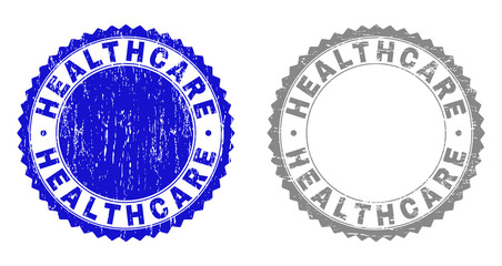 Obraz premium Grunge HEALTHCARE stamp seals isolated on a white background. Rosette seals with grunge texture in blue and gray colors. Vector rubber stamp imprint of HEALTHCARE caption inside round rosette.