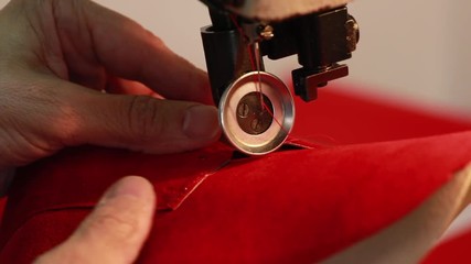 closeup of sewing machine, sew leather for shoe parts before assembly on making shoes workshop by handmade artisan expert in manufacturing leather shoe, manufacture traditional shoemaker craftsman
