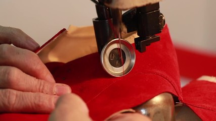 closeup of sewing machine, sew leather for shoe parts before assembly on making shoes workshop by handmade artisan expert in manufacturing leather shoe, manufacture traditional shoemaker craftsman