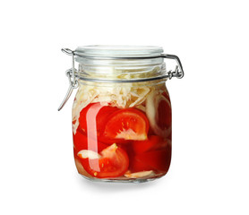 Glass jar with fermented vegetables on white background