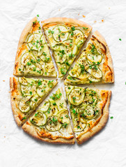 Vegan macadamia ricotta and squash pizza on light background, top view