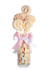 Glass bottle with sweet marshmallow on white background