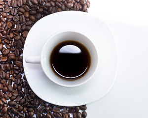 Coffee cup and beans on a white background.