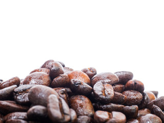 Coffee beans in coffee cup isolated on white