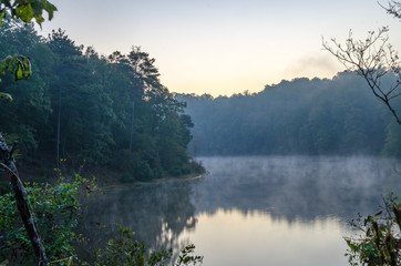 Fog forms over part of a water reservoir near Oxford, Alabama, USA