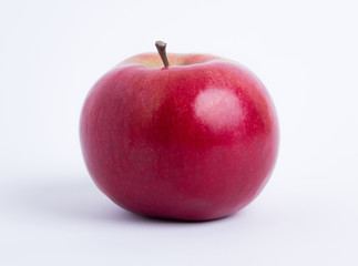 fresh red apple closeup on white background. healthy vegetarian organic food