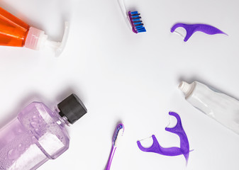Dental care products lthe white background, top view