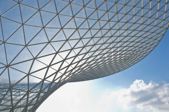 Exterior Of A Building In Shanghai, Modern Curved Exterior With Panes Of Glass. 