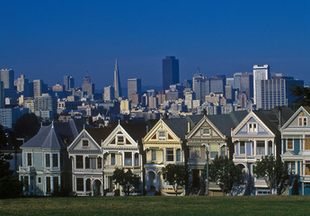 Historic houses in San Francisco and modern architecture behind. 