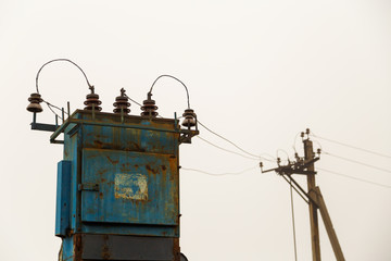 Electricity of the net. Electric transformer and power line pylon. Relation of electrical networks....