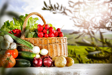 Vegetables in the basket box  chest on the wooden table background