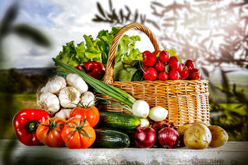 Vegetables in the basket box  chest on the wooden table background