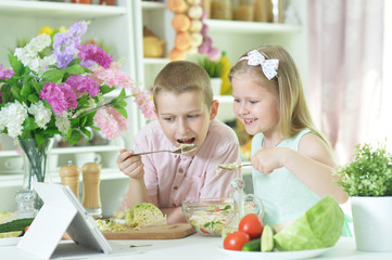 Portrait of brother and sister cooking together