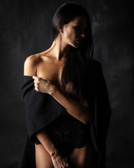 brunette lady with beautiful hair on black