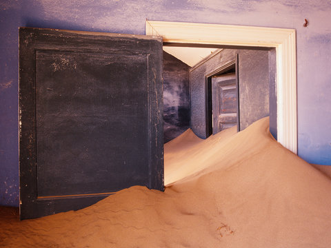 Drifting sand in a building, nature overtaking the space