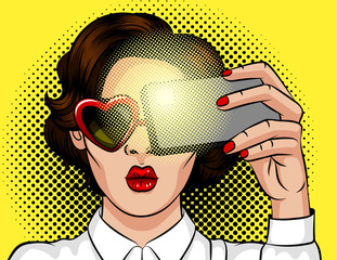 Color vector illustration in pop art style. Brunette girl with heart-shaped sunglasses. Beautiful lady with red lips  posing for photo over yellow background. Girl makes selfie on smartphone.
