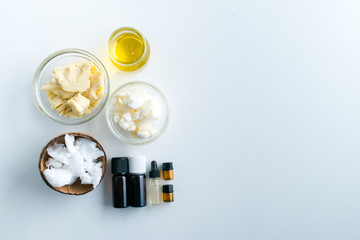 diy body butter with ingrdients on concrete background