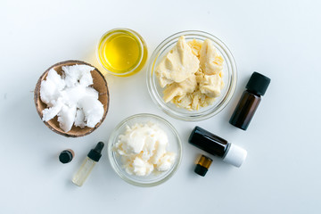 diy body butter with ingrdients on concrete background