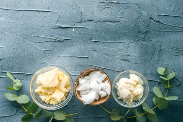 diy body butter with ingrdients on concrete background