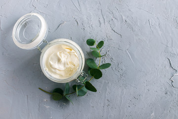 diy body butter with ingrdients on concrete background