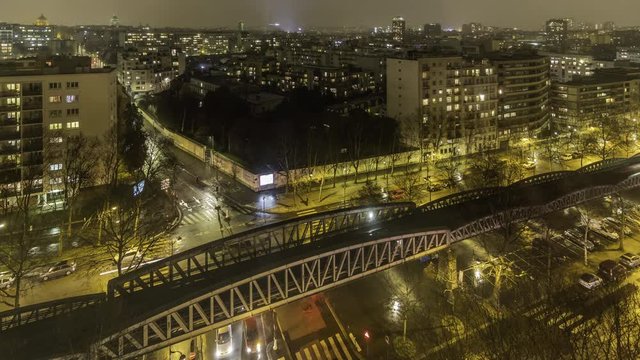 France, Paris, Febuary 2019: timelapse at night of Saint jacques boulevard with the subway bridge in front.